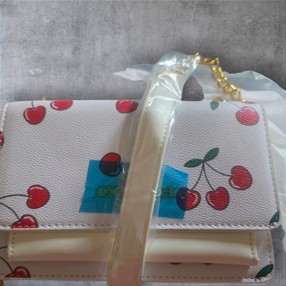 White and Red Cherry Print Shoulder Bag with Gold Accents